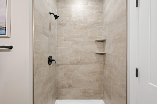 bathroom with tiled shower