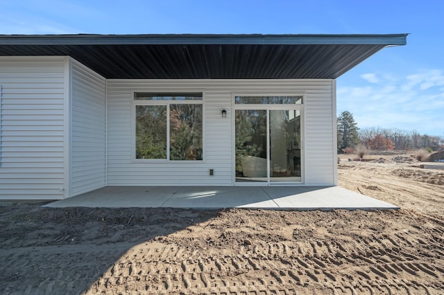 back of property with a patio