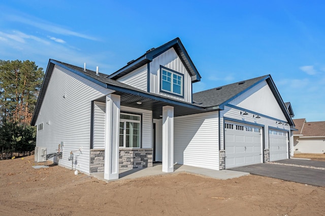 craftsman house with a garage