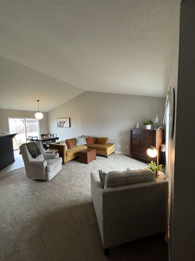 living room with carpet and vaulted ceiling