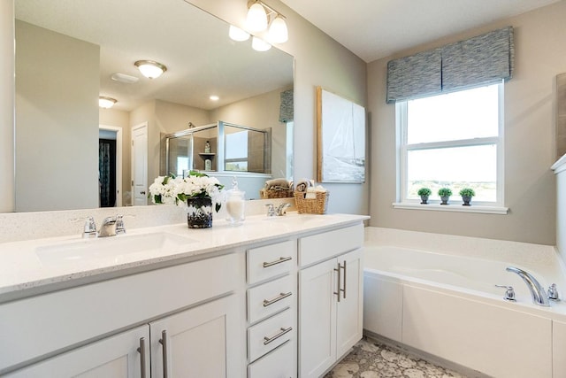 bathroom with shower with separate bathtub and vanity