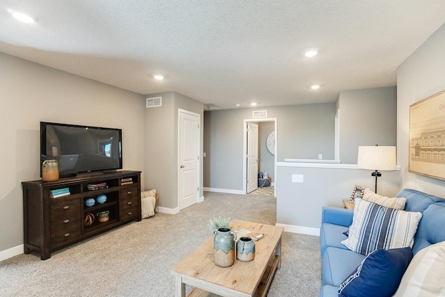 living room with light carpet and a textured ceiling