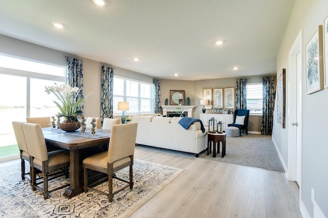 dining area featuring recessed lighting, light wood-style flooring, and baseboards