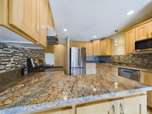 kitchen with kitchen peninsula, appliances with stainless steel finishes, backsplash, light brown cabinetry, and extractor fan