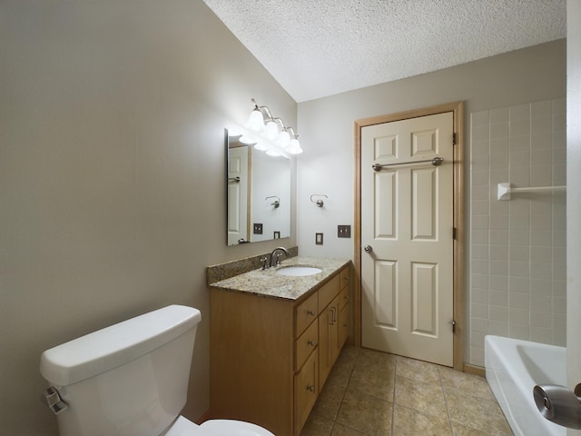 bathroom featuring a tub, tile patterned floors, a textured ceiling, toilet, and vanity