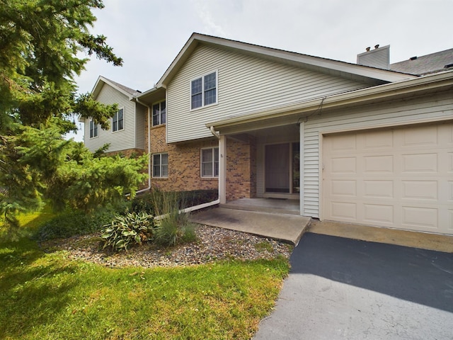 view of front of property with a garage