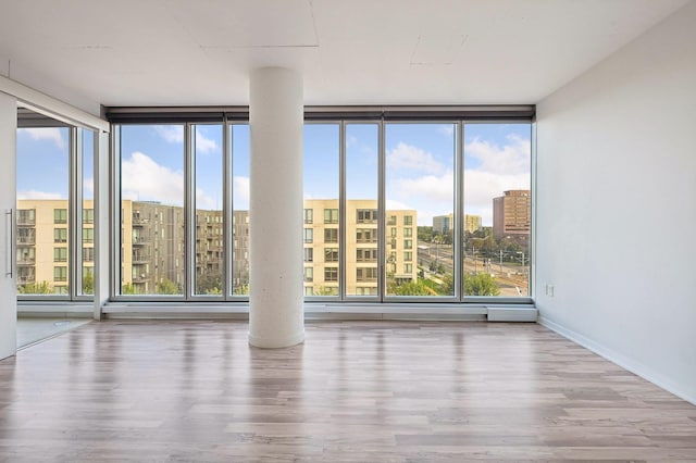 unfurnished room featuring floor to ceiling windows and a wealth of natural light