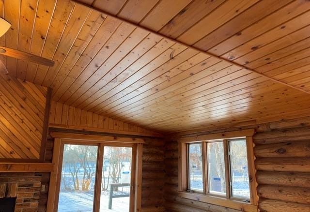 room details featuring rustic walls and wood ceiling