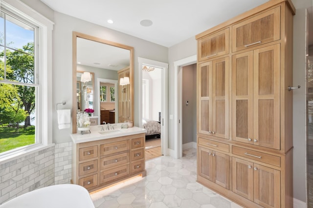 bathroom featuring vanity, tile patterned floors, and a wealth of natural light