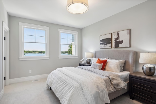 bedroom with light colored carpet