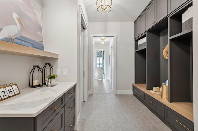 mudroom with a notable chandelier