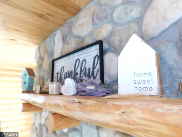 interior details with wood ceiling and log walls