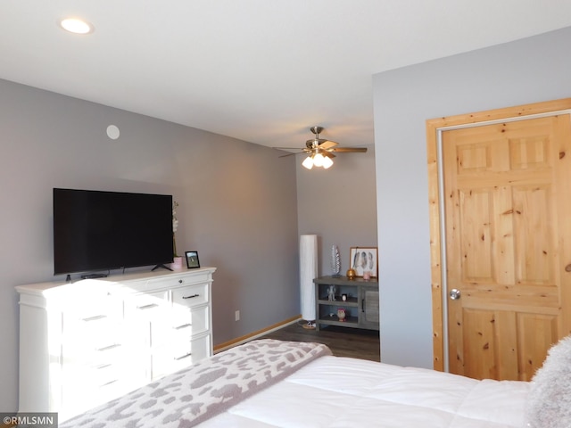 bedroom with dark wood-type flooring