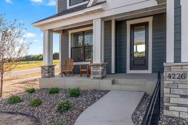 property entrance featuring covered porch