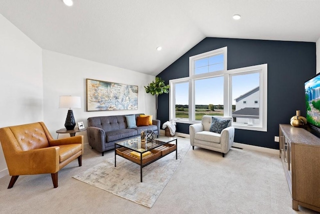 living room with light carpet, high vaulted ceiling, and recessed lighting