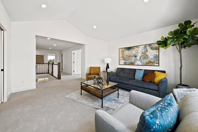 living area with vaulted ceiling, light carpet, baseboards, and recessed lighting