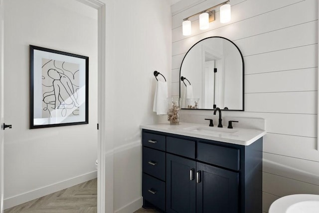 bathroom with baseboards and vanity