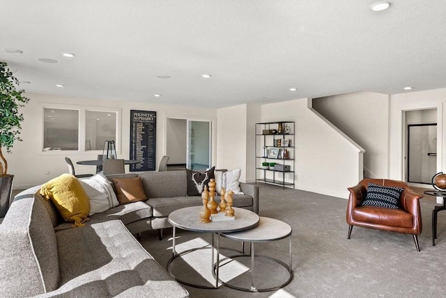 living area featuring carpet flooring and recessed lighting