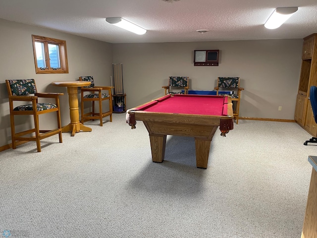 recreation room featuring carpet, a textured ceiling, and billiards