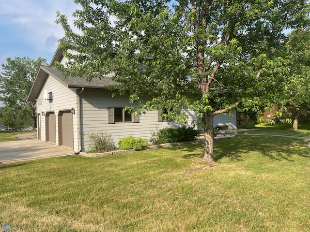 view of front of home with a garage and a front yard