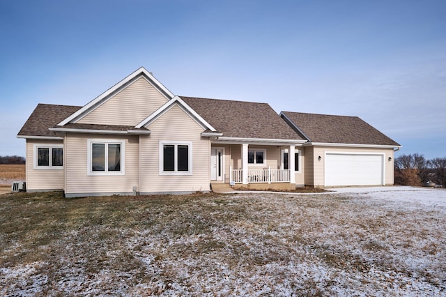 view of front of house featuring covered porch and a garage