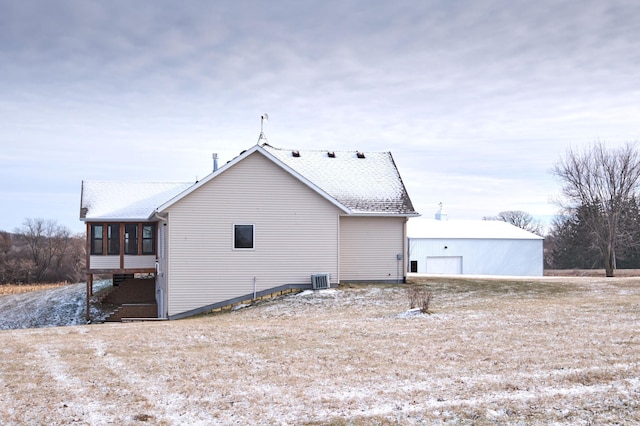 view of side of home with a sunroom