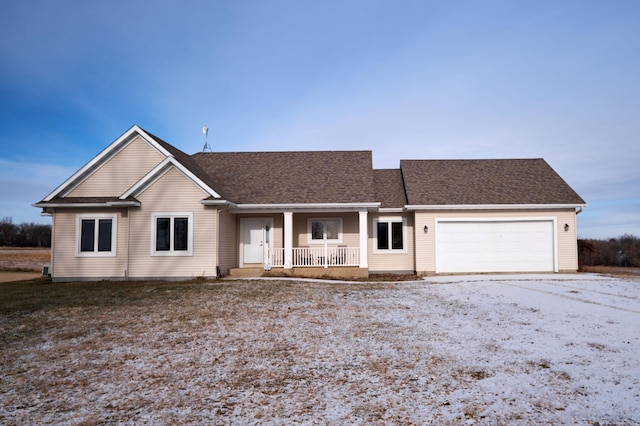 single story home with a porch and a garage