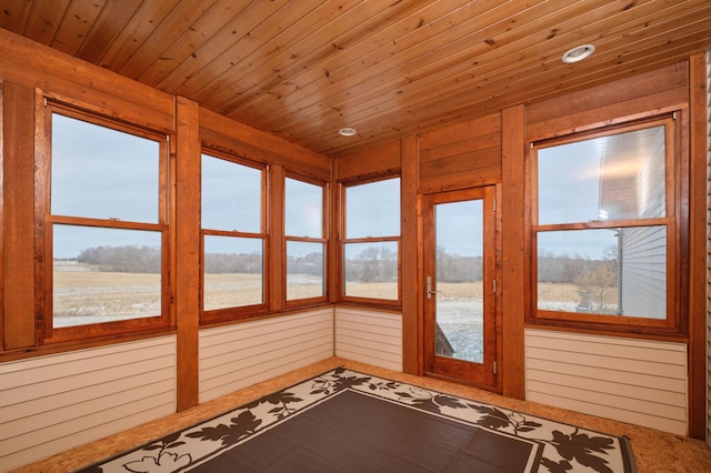 unfurnished sunroom with wooden ceiling