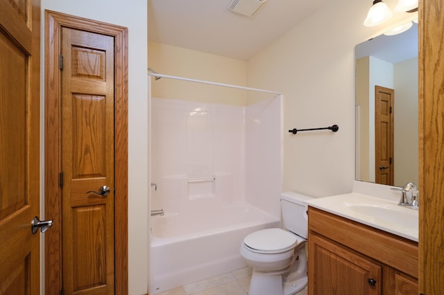 full bathroom featuring tile patterned floors, bathing tub / shower combination, vanity, and toilet