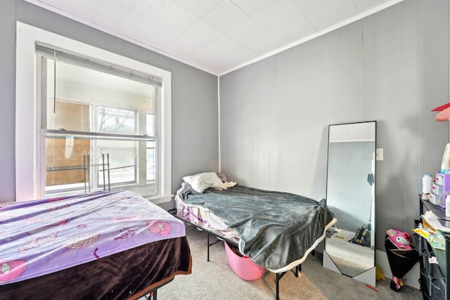 bedroom featuring carpet and crown molding