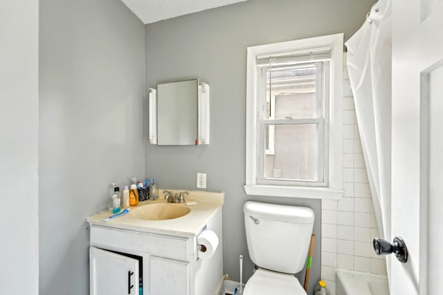 full bathroom featuring toilet and vanity