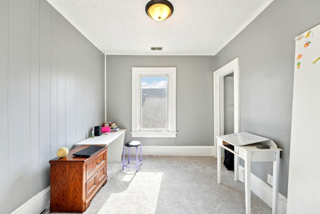 interior space with baseboards, ornamental molding, visible vents, and light colored carpet