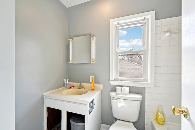 full bathroom featuring toilet and vanity