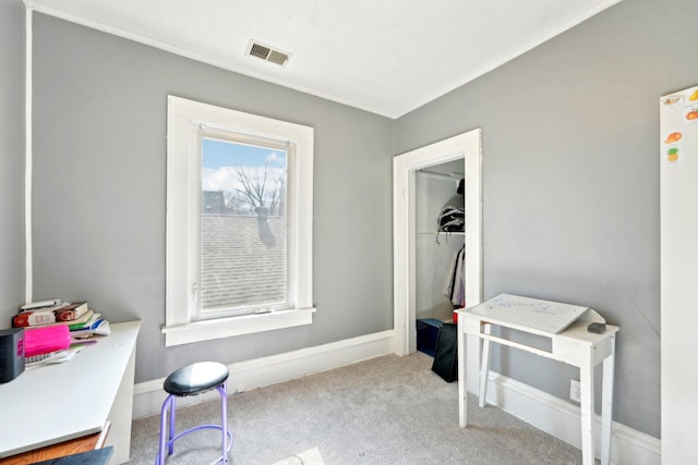 interior space with crown molding, visible vents, and baseboards