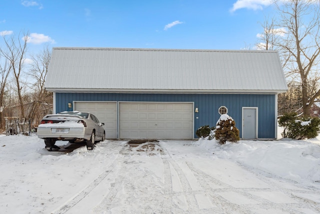 view of snow covered garage