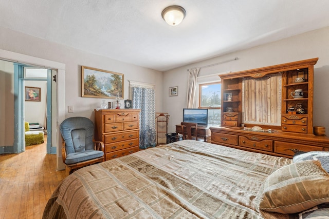 bedroom featuring hardwood / wood-style flooring