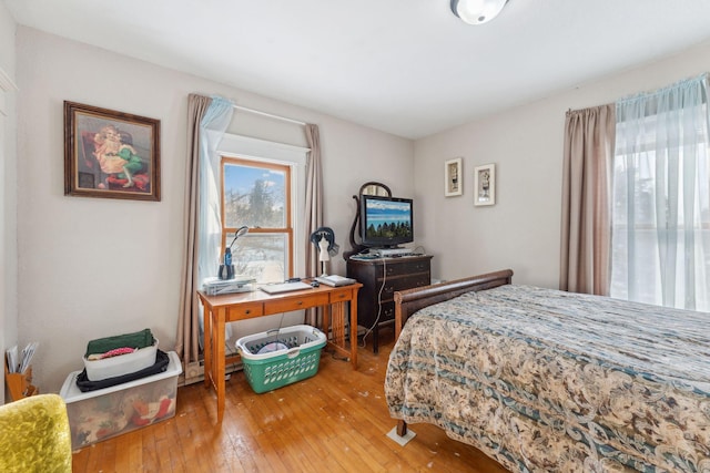 bedroom with wood-type flooring