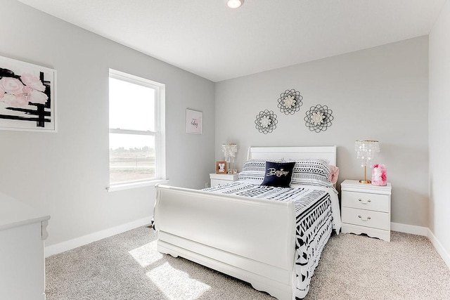 bedroom featuring light carpet