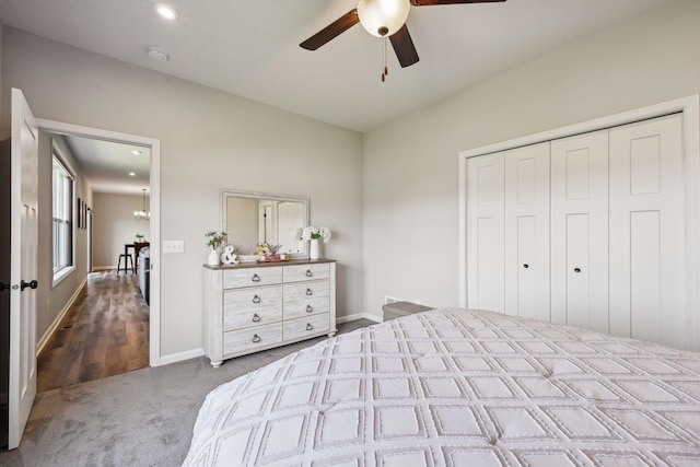 unfurnished bedroom featuring a closet, baseboards, a ceiling fan, and carpet