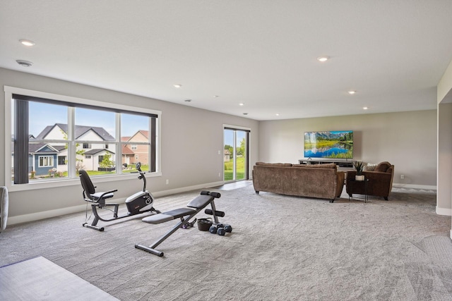 exercise area with baseboards, carpet, and recessed lighting