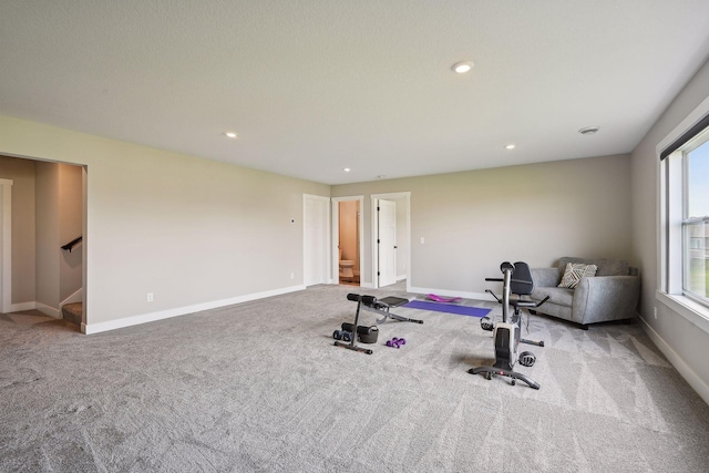 workout room with baseboards, recessed lighting, and carpet