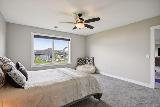 bedroom with carpet floors, baseboards, and a ceiling fan