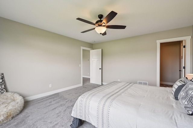 bedroom with carpet flooring, baseboards, a ceiling fan, and visible vents