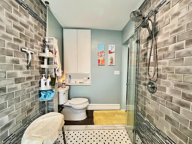 bathroom featuring toilet and tiled shower