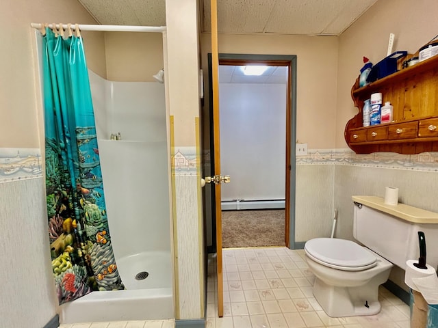 bathroom featuring a paneled ceiling, a shower with curtain, toilet, and a baseboard heating unit