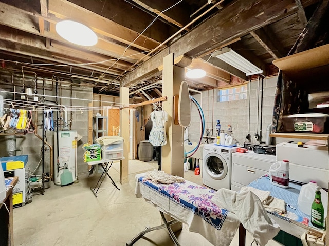 basement with separate washer and dryer and water heater