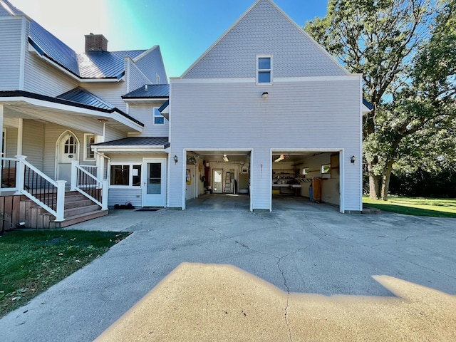 rear view of property with a garage