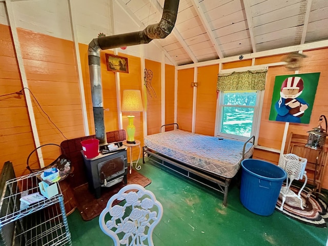 bedroom featuring vaulted ceiling with beams, wood walls, and wood ceiling