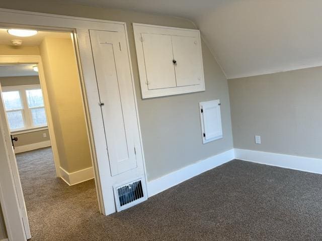 laundry room featuring dark colored carpet