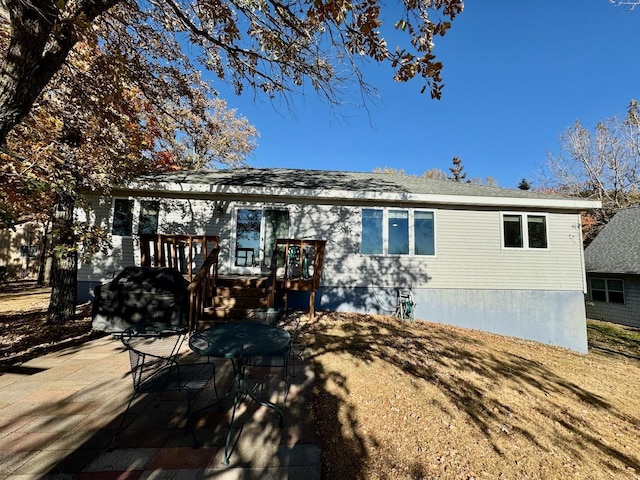 rear view of house with a patio